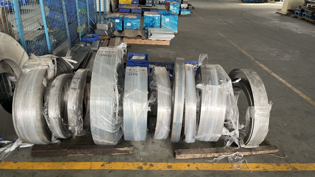 Steel coil and strip stored on site.