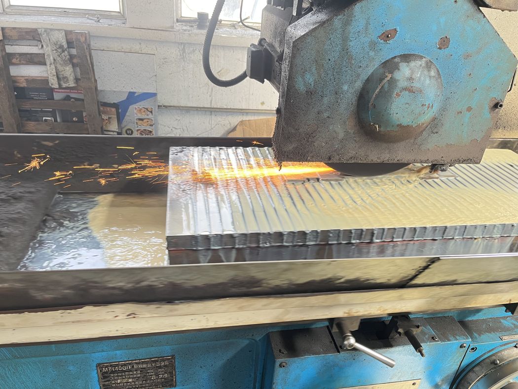 Surface grinder used for tool and die maintenance.