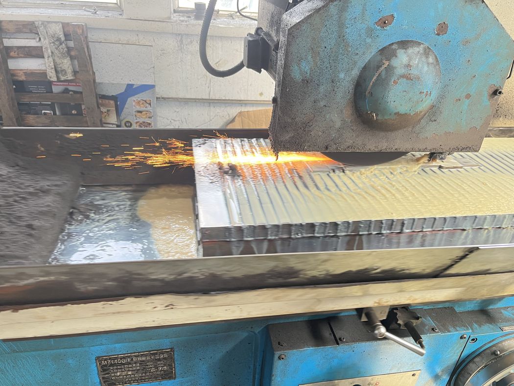 Grinding a die on the surface grinder.