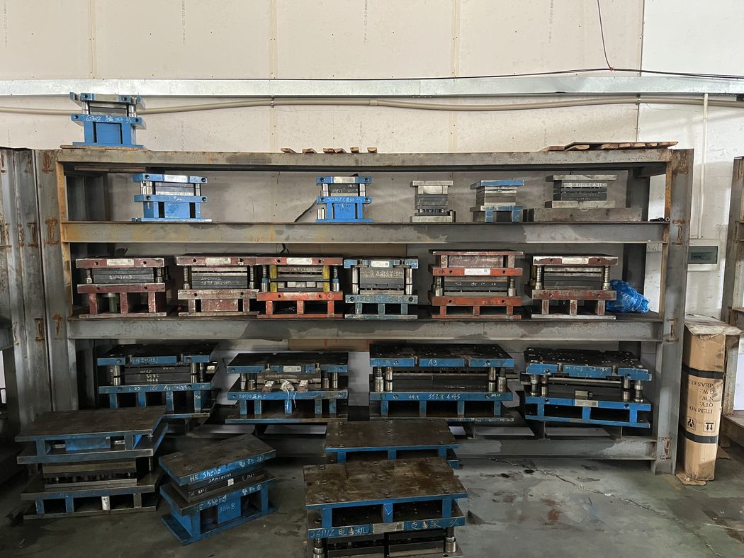 Dies and spares stored beside the presses.