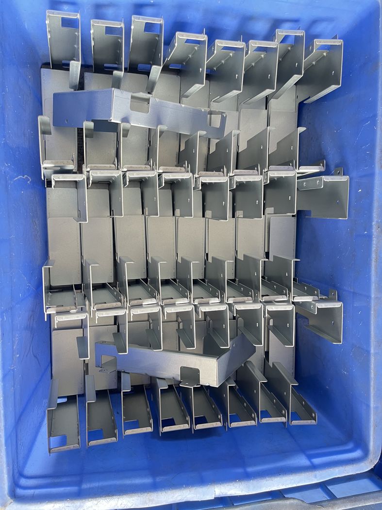 Hinge blanks after stamping.